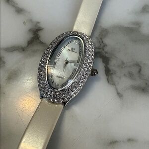 Jean Dousset white oval rhinestone studded watch